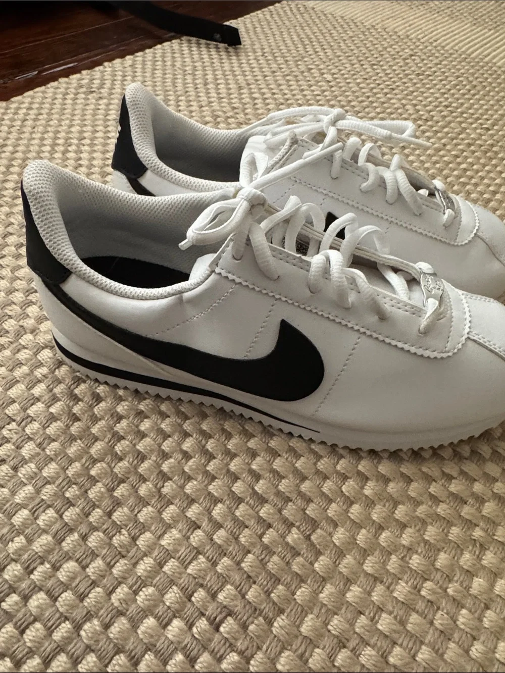Nike Kids White Sneakers with Black Swoosh